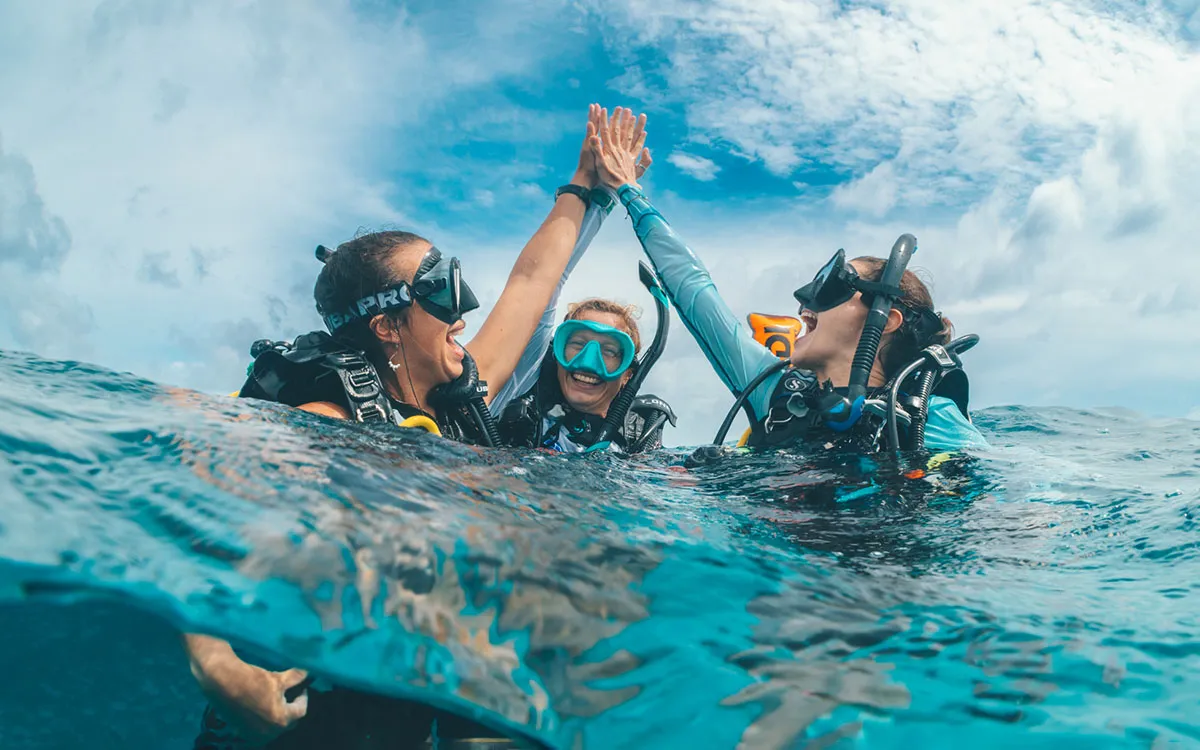 Instructor accompanying a try scuba student